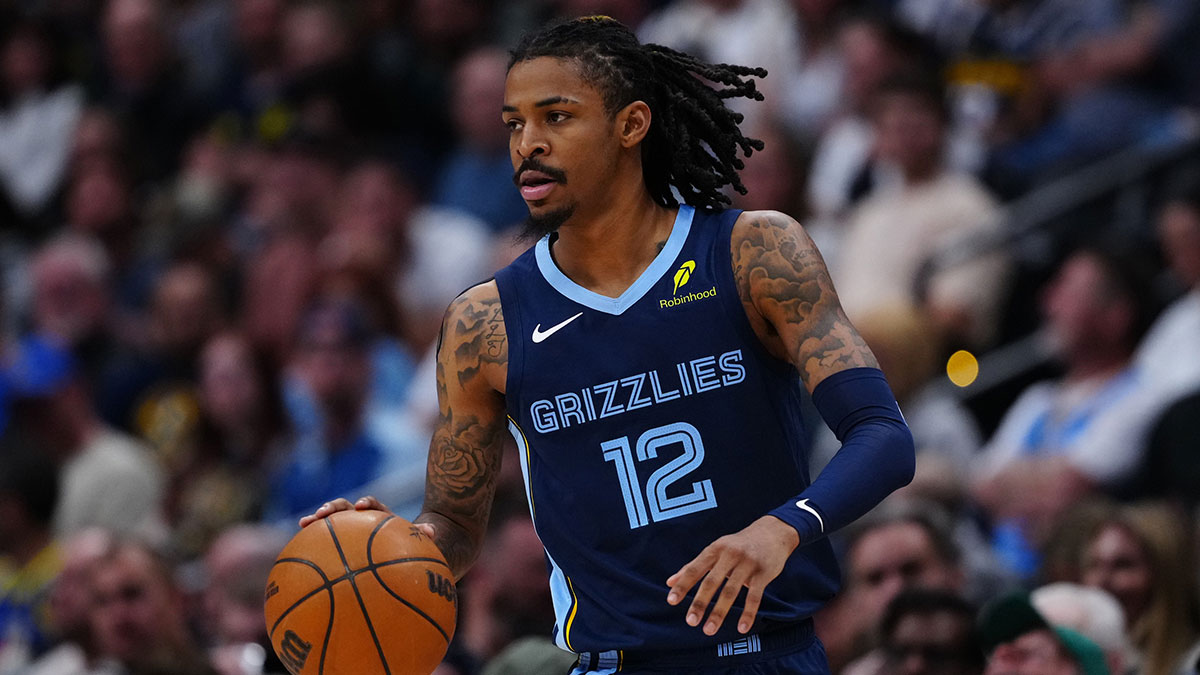 Memphis Grizzlies guard Ja Morant (12) controls the ball in the second quarter against the Denver Nuggets at Ball Arena.