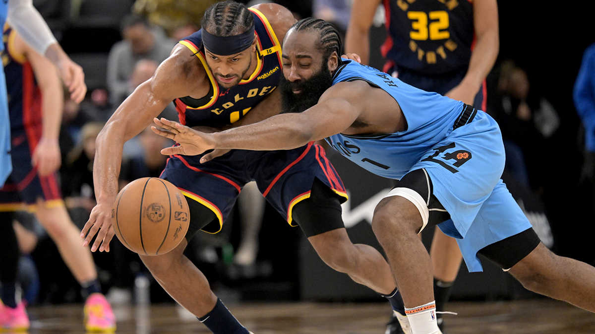 Golden State Warriors guard Moses Moody (4) and Los Angeles Clippers guard James Harden (1) reach for a loose ball in the second half at Intuit Dome