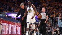Golden State Warriors forward Draymond Green (23) walks towards the team bench with head coach Steve Kerr after a play against the Memphis Grizzlies in the third quarter at the Chase Center.