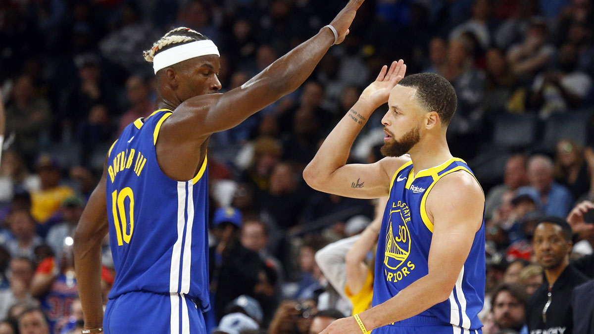 Golden State Warriors forward Jimmy Butler III (10) reacts with guard Stephen Curry (30) during the fourth quarter against the Memphis Grizzlies at FedExForum.