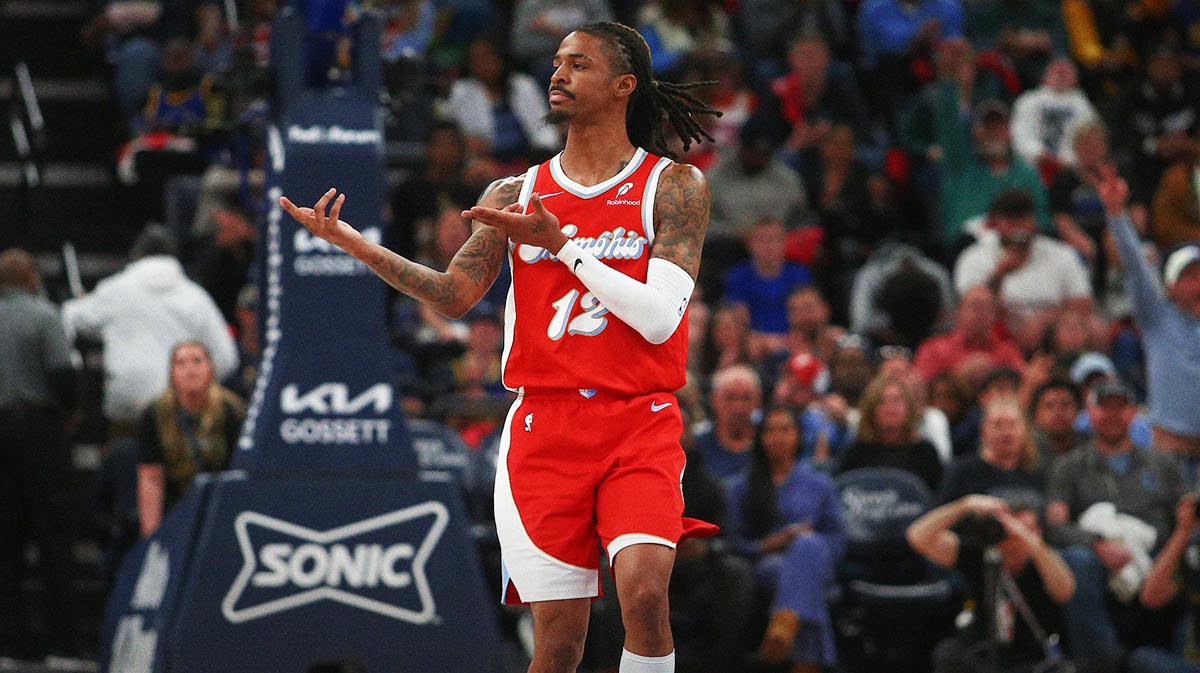 Memphis Grizzlies guard Ja Morant (12) reacts after a basket during the second quarter against the Golden State Warriors at FedExForum.
