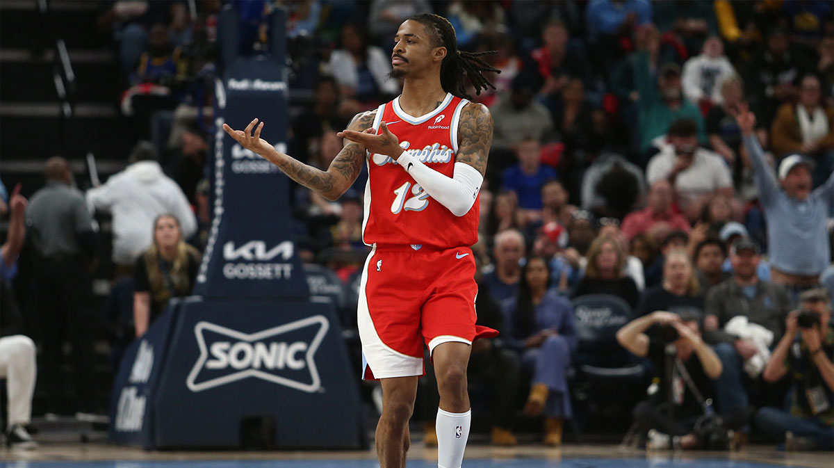 Apr 1, 2025; Memphis, Tennessee, USA; Memphis Grizzlies guard Ja Morant (12) reacts after a basket during the second quarter against the Golden State Warriors at FedExForum.