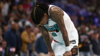 Memphis Grizzlies guard Ja Morant (12) stands by the bench on crutches during the fourth quarter against the Oklahoma City Thunder during game three for the first round of the 2024 NBA Playoffs at FedExForum.