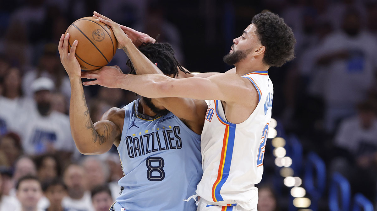 Memphis Grizzlies forward Lamar Stevens (8) and Oklahoma City Thunder guard Ajay Mitchell (25) fight for control of the ball during the second half at Paycom Center. Mandatory Credit: Alonzo Adams-Imagn Images
