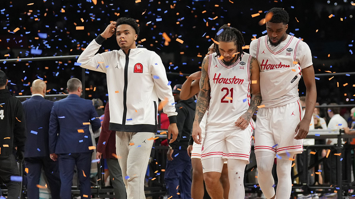Houston Cougars guard Emanuel Sharp (21) and teammates walk off the court after losing to the Florida Gators in the national championship game of the Final Four of the 2025 NCAA Tournament at the Alamodome.