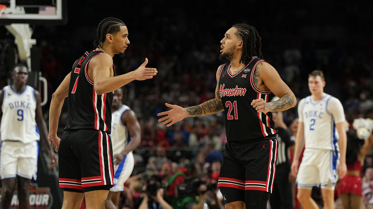 Houston Cougars guard Milos Uzan (7) high fives guard Emanuel Sharp (21) after a play against the Duke Blue Devils during the second half in the semifinals of the men's Final Four of the 2025 NCAA Tournament at the Alamodome.