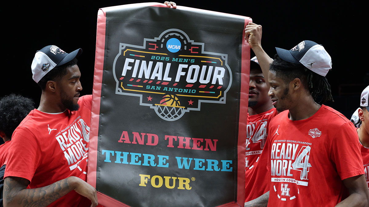 The Houston Cougars react on the stage after defeating the Tennessee Volunteers during the Midwest Regional final of the 2025 NCAA tournament at Lucas Oil Stadium.