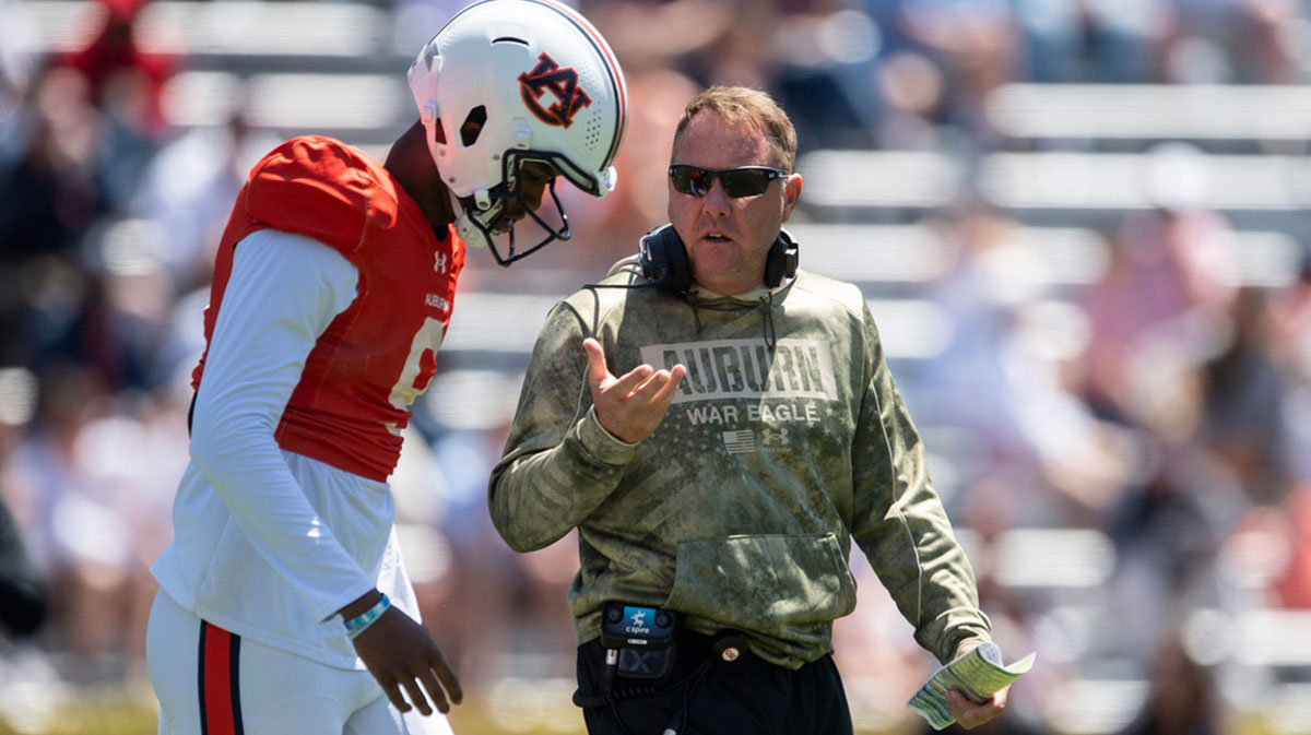 Auburn Tigers head coach Hugh Freeze talks with quarterback Deuce Knight (9) during Auburn Tigers A-Day football practice at Jordan-Hare Stadium in Auburn, Ala., on Saturday, April 12, 2025.