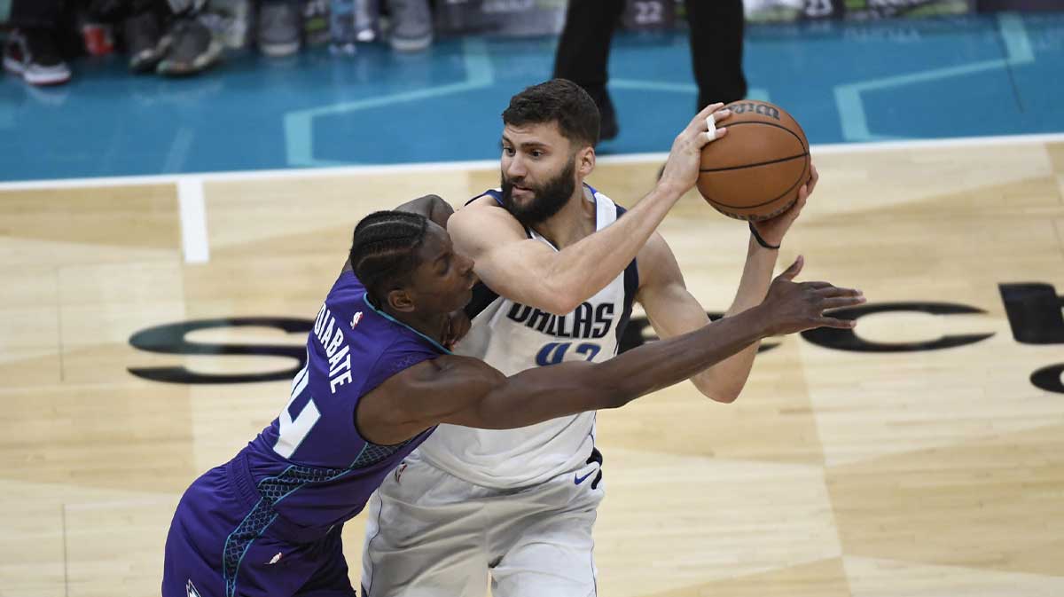 Charlotte Hornets forward Moussa Diabate (14) attempts to steal the ball from Dallas Mavericks forward Maxi Kleber (42) during the second half at the Spectrum Center.