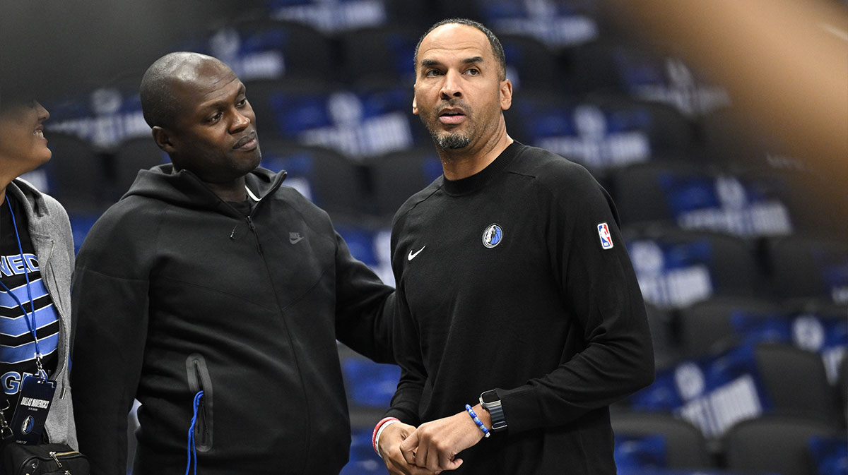 Dallas Mavericks general manager Nico Harrison (right) looks on during warms up before the game between the Dallas Mavericks and the Memphis Grizzlies at the American Airlines Center.