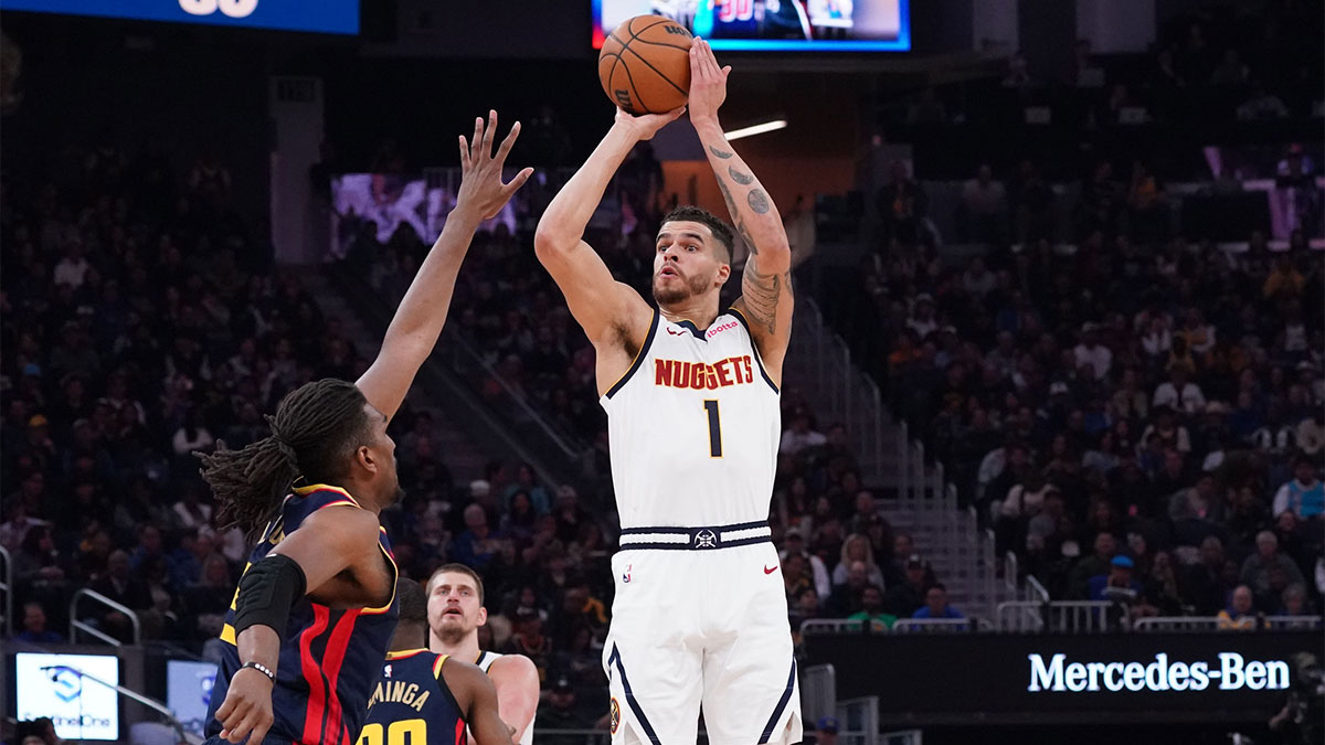 Denver Nuggets forward Michael Porter Jr. (1) shoots over Golden State Warriors forward Kevon Looney (5) in the second period at Chase Center.