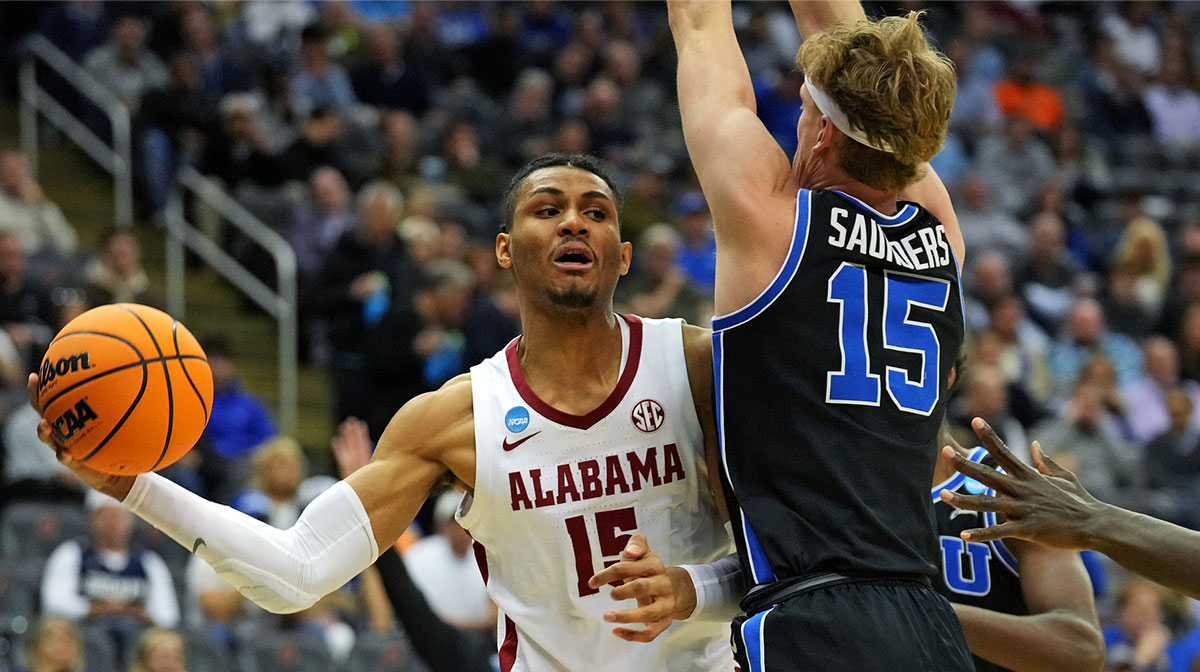 Alabama Crimson Tide forward Jarin Stevenson (15) passes the ball against Brigham Young Cougars forward Richie Saunders (15) during the first half during an East Regional semifinal of the 2025 NCAA tournament at Prudential Center.