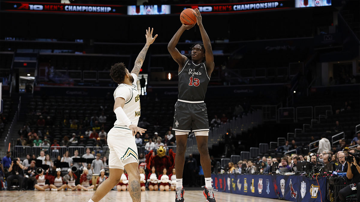 Saint Joseph's Hawks forward Rasheer Fleming (13) shoots the ball over Saint Joseph's Hawks forward Shawn Simmons II (10) in the first half at Capital One Arena.