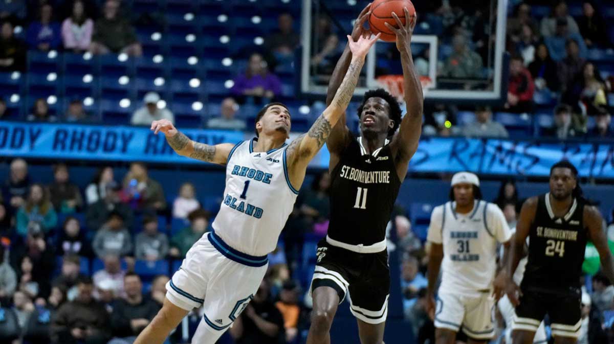 Sebastian Thomas of the Rams leaps to try to intercept a first half pass to St. Bonaventure guard Melvin Council Jr.