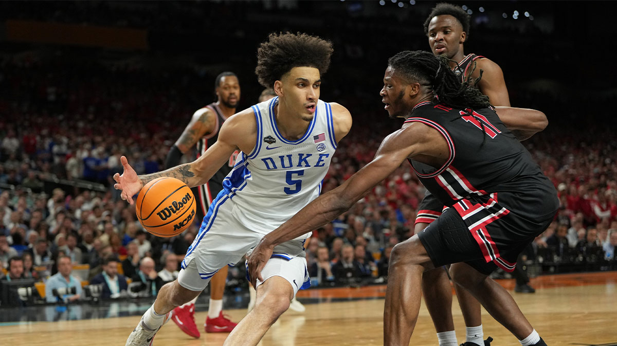 Duke Blue Devils guard Tyrese Proctor (5) drives to the basket against Houston Cougars forward Joseph Tugler (11) during the second half in the semifinals of the men's Final Four of the 2025 NCAA Tournament at the Alamodome.
