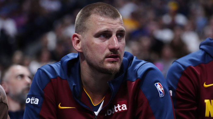 Denver Nuggets center Nikola Jokic (15) on the bench in the second quarter against the Memphis Grizzliesat Ball Arena.