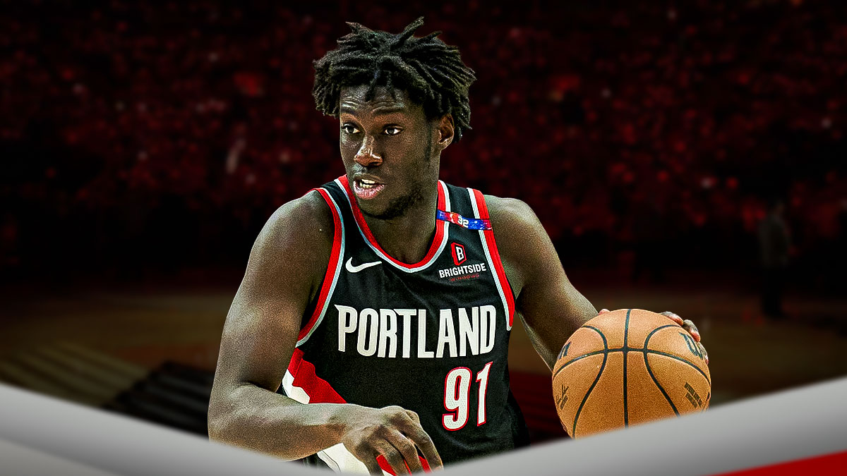 Portland Trail Blazers player Sidy Cissoko with the Trail Blazers arena in the background