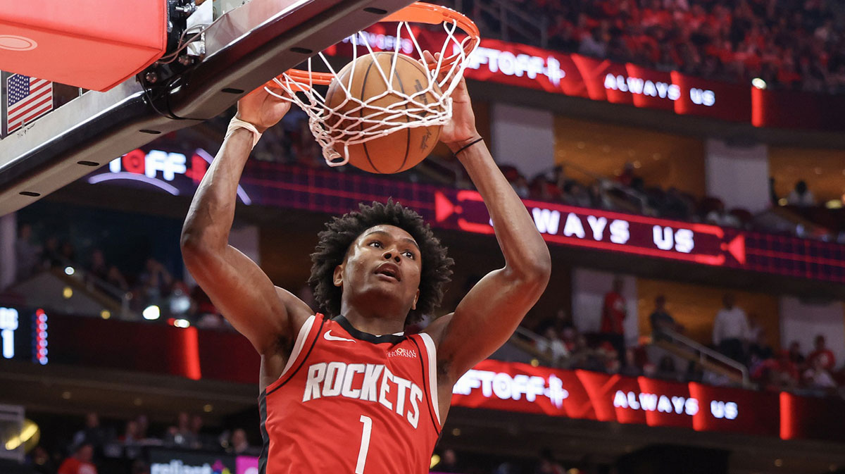 Houston Rockets forward Amen Thompson (1) dunks against the Golden State Warriors in the fourth quarter during game five of first round for the 2025 NBA Playoffs at Toyota Center.