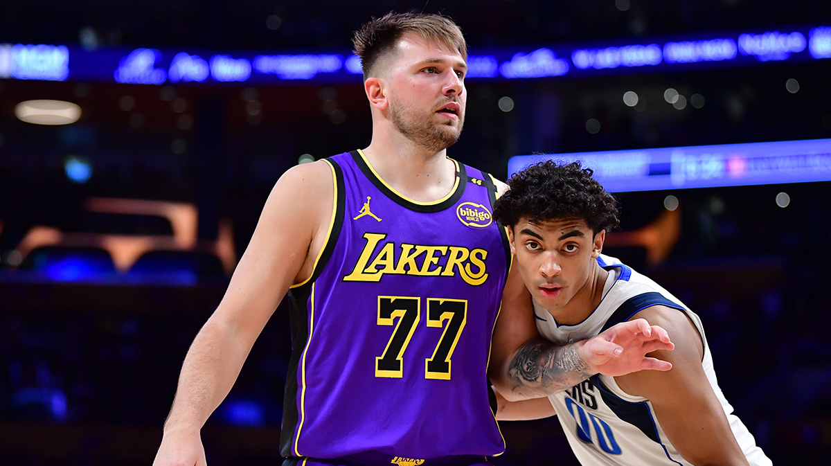 Los Angeles Lakers guard Luka Doncic (77) attempts to gain position on Dallas Mavericks guard Max Christie (00) during the second half at Crypto.com Arena.