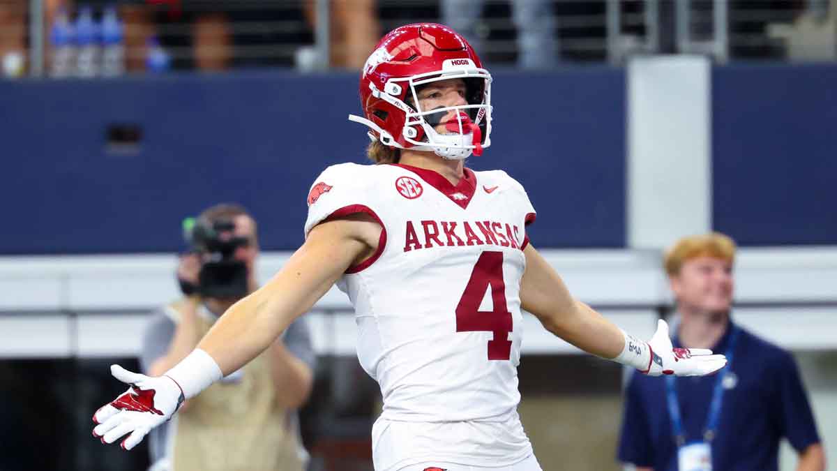 Sep 28, 2024; Arlington, Texas, USA; Arkansas Razorbacks wide receiver Isaac TeSlaa (4) celebrates after scoring a touchdown during the first quarter against the Texas A&M Aggies at AT&T Stadium.