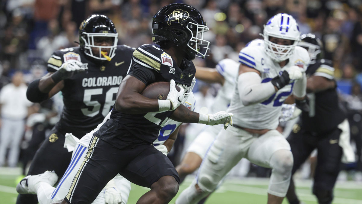 Colorado Buffaloes running back Isaiah Augustave (23) runs with the ball during the second quarter against the Brigham Young Cougars at Alamodome.