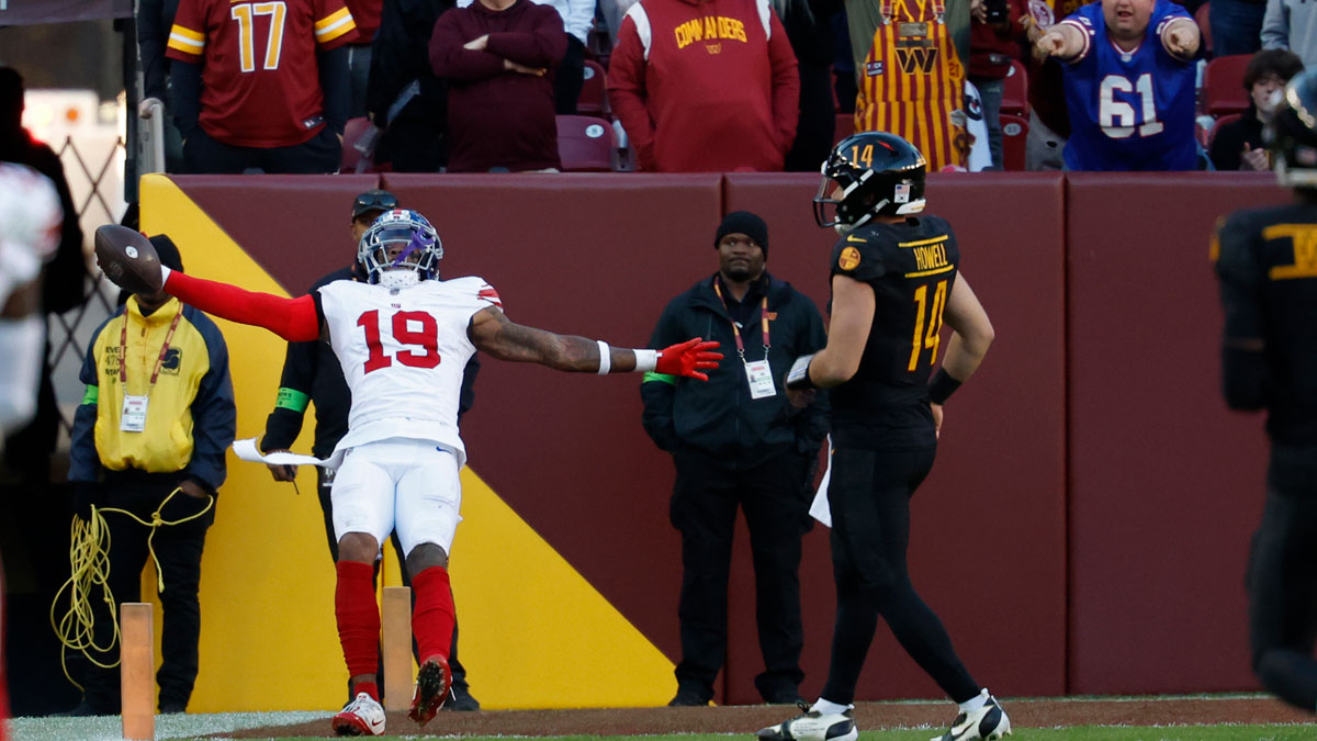 New York Giants safety Isaiah Simmons (19) celebrates while scoring a touchdown on an interception of Washington Commanders quarterback Sam Howell (14) in the final minute during the fourth quarter at FedExField.