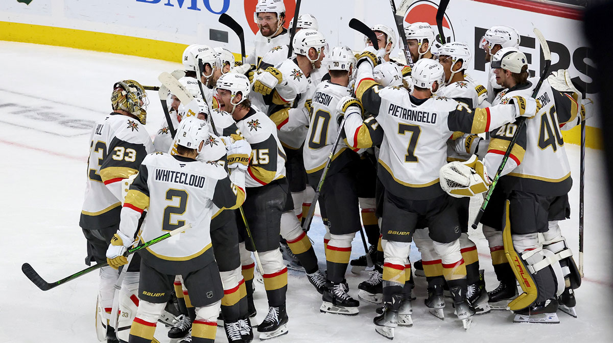 Vegas Golden Knights center Ivan Barbashev (49) celebrates with teammates after he puts the puck past Minnesota Wild goaltender Filip Gustavsson (32) during 1st OT in game four of the first round of the 2025 Stanley Cup Playoffs at Xcel Energy Center. Vegas Golden Knights win 4-3.