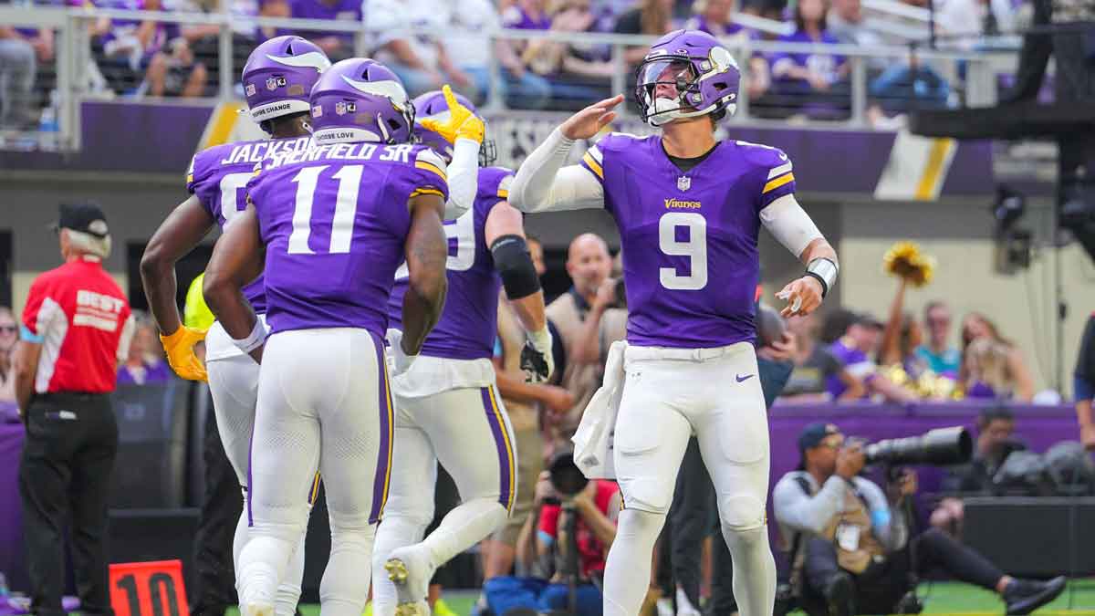 Minnesota Vikings quarterback J.J. McCarthy (9) celebrates wide receiver Trent Sherfield Sr. (11) touchdown against the Las Vegas Raiders in the third quarter at U.S. Bank Stadium.