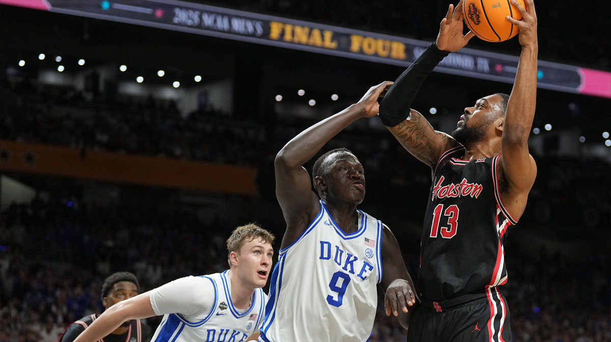 Houston Cougars forward J'Wan Roberts (13) is defended by Duke Blue Devils center Khaman Maluach (9) in the semifinals of the men's Final Four of the 2025 NCAA Tournament at the Alamodome.