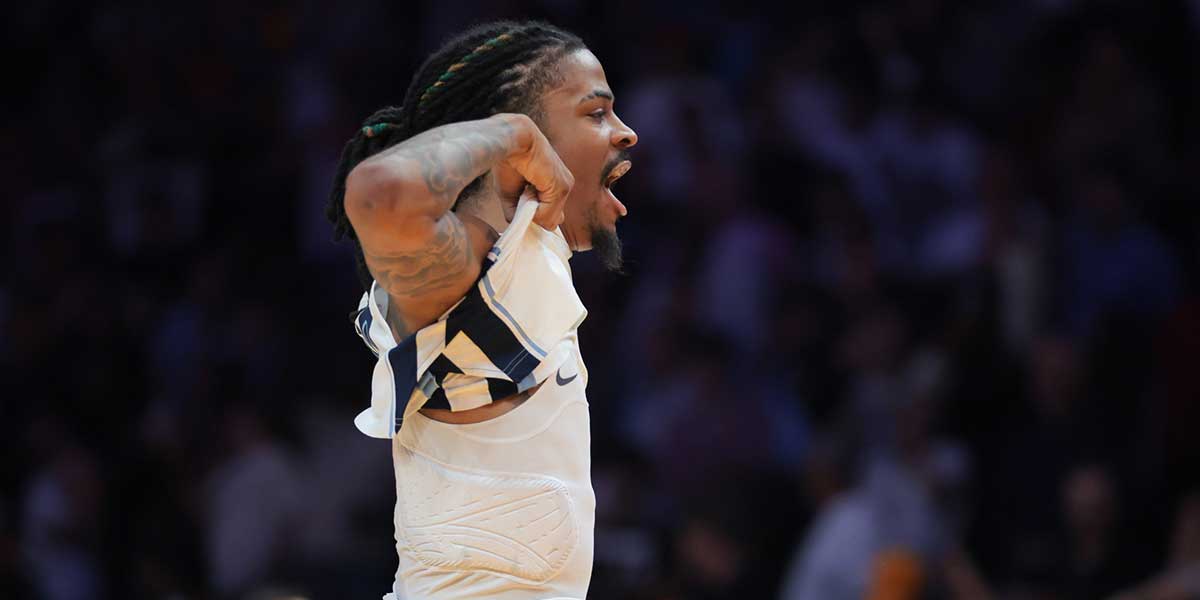 Memphis Grizzlies guard Ja Morant (12) reacts after scoring the game-winning shot against the Miami Heat during the fourth quarter at Kaseya Center.