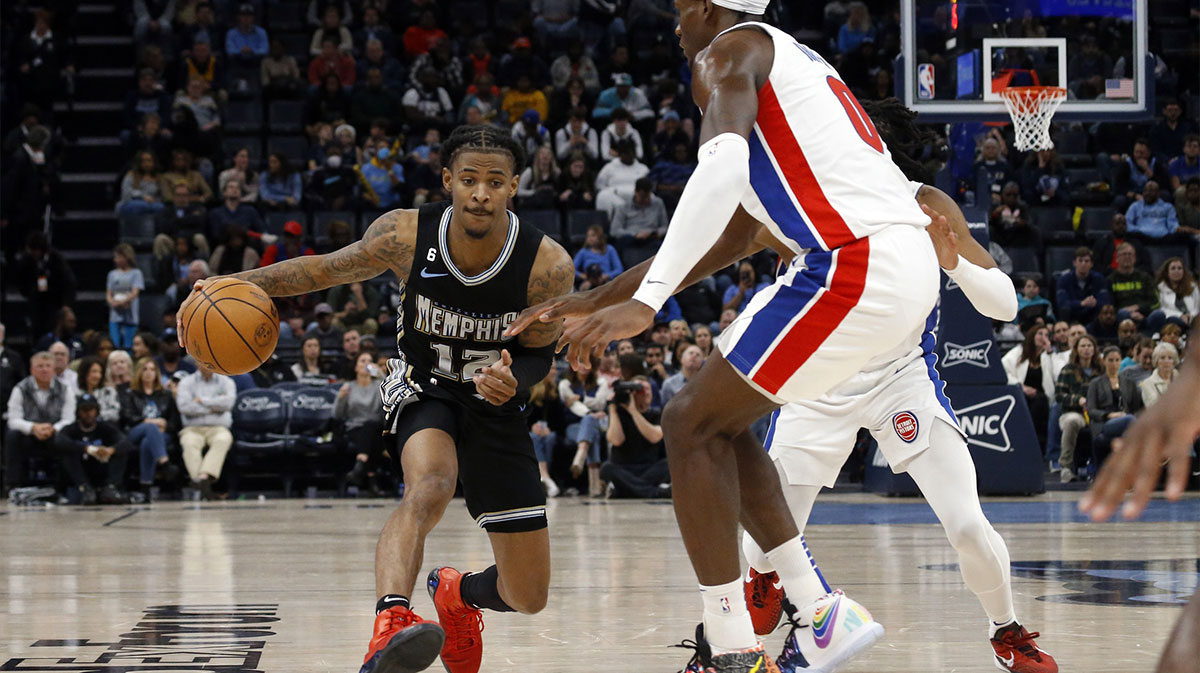 Memphis Grizzlies guard Ja Morant (12) dribbles as Detroit Pistons center Jalen Duren (0) defends during the second half at FedExForum.