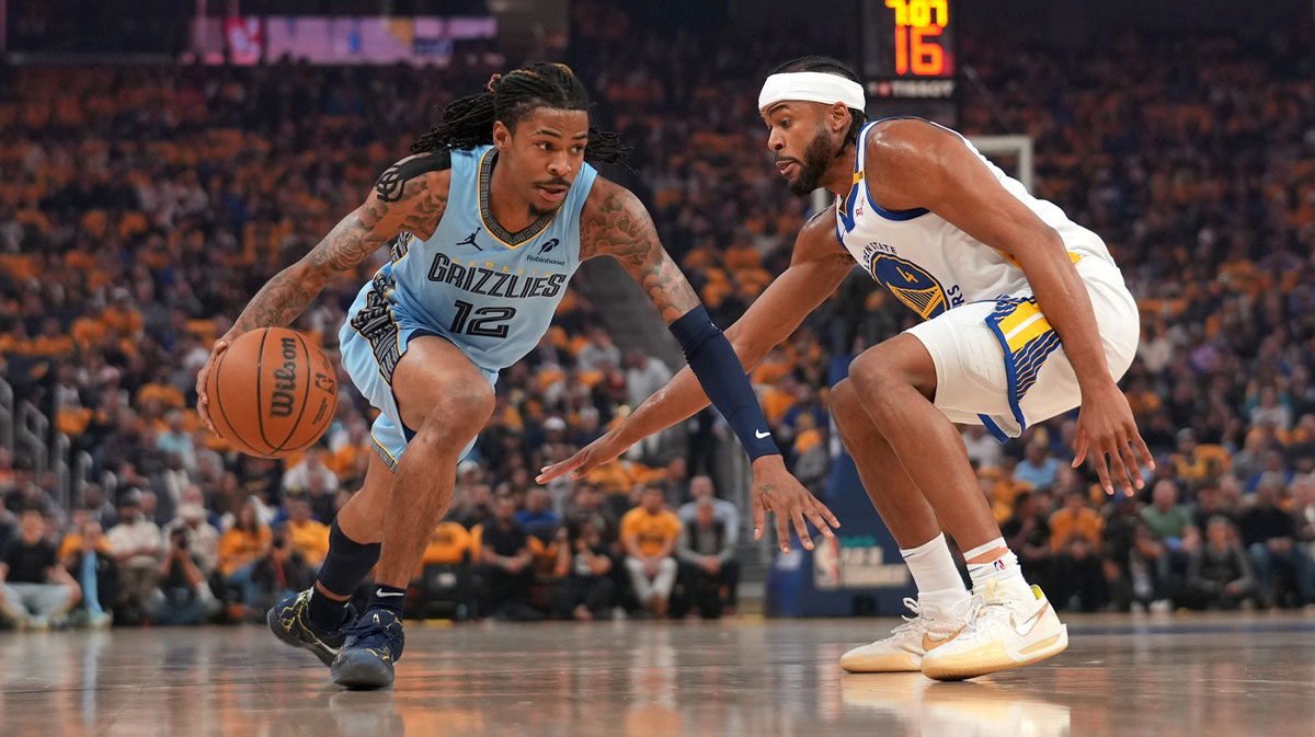 Memphis Grizzlies guard Ja Morant (12) dribbles the ball next to Golden State Warriors guard Moses Moody (4) in the first quarter at the Chase Center.