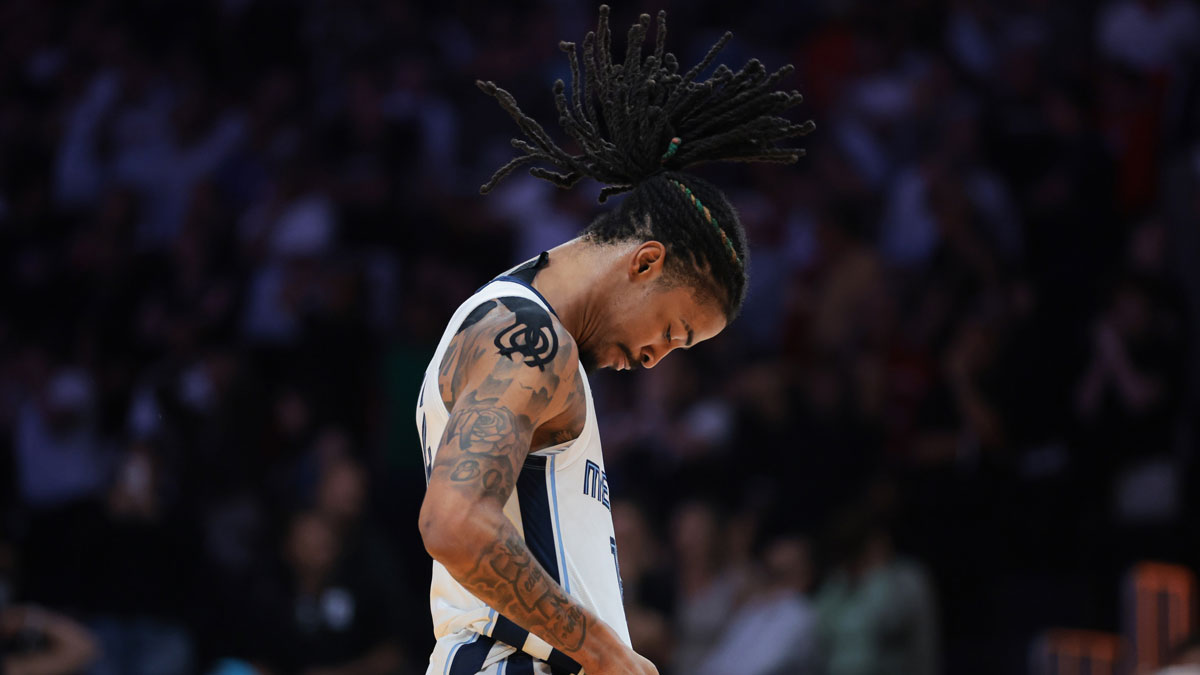 Memphis Grizzlies guard Ja Morant (12) reacts after scoring the game-winning shot against the Miami Heat during the fourth quarter at Kaseya Center.