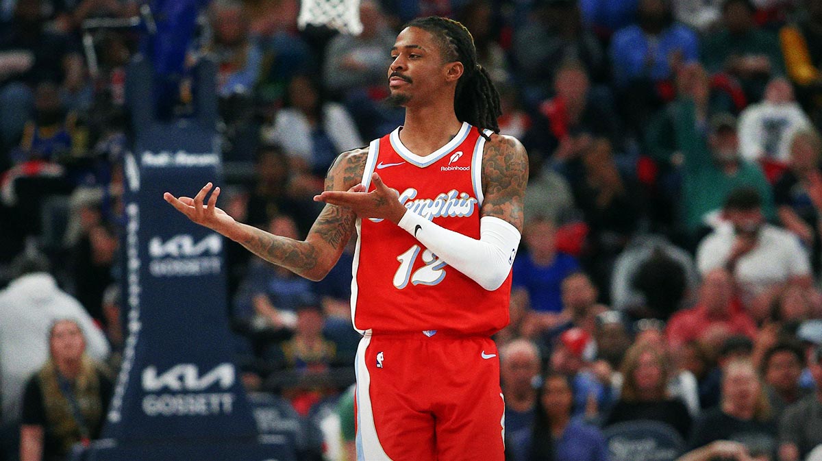 Memphis Grizzlies guard Ja Morant (12) reacts after a basket during the second quarter against the Golden State Warriors at FedExForum.