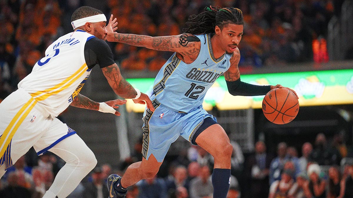 Memphis Grizzlies guard Ja Morant (12) dribbles past Golden State Warriors guard Gary Payton II (0) in the second quarter at the Chase Center.