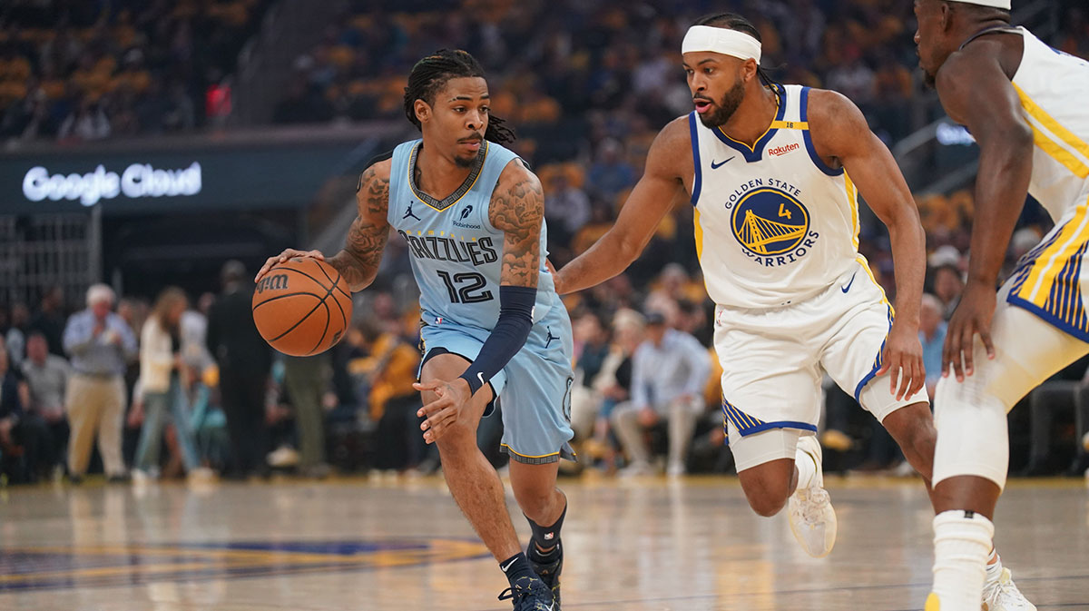 Memphis Grizzlies guard Ja Morant (12) dribbles the ball in front of Golden State Warriors guard Moses Moody (4) in the first quarter at the Chase Center.