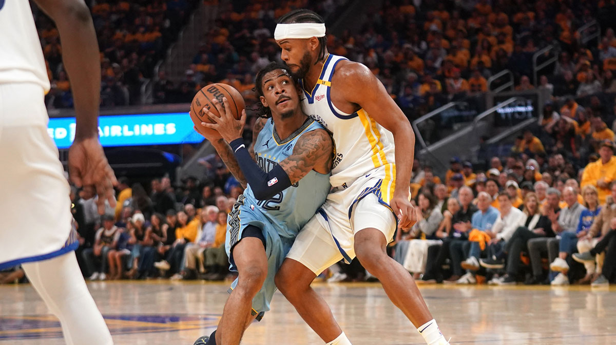 Memphis Grizzlies guard Ja Morant (12) is defended by Golden State Warriors guard Moses Moody (4) in the second quarter at the Chase Center.