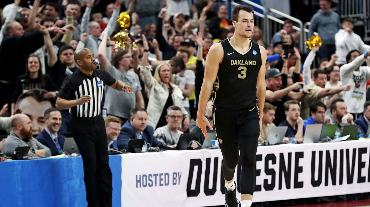 Oakland Golden Grizzlies guard Jack Gohlke (3) celebrates after making a three pointer during the second half of the game against the North Carolina State Wolfpack in the second round of the 2024 NCAA Tournament at PPG Paints Arena.