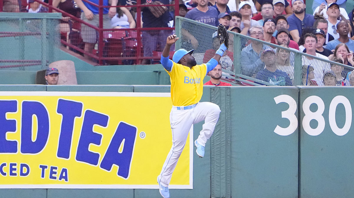 Boston Red Sox right fielder Jackie Bradley Jr. (19) makes a leaping catch on a fly ball hit by Cleveland Guardians left fielder Steven Kwan (not pictured) during the third inning at Fenway Park.