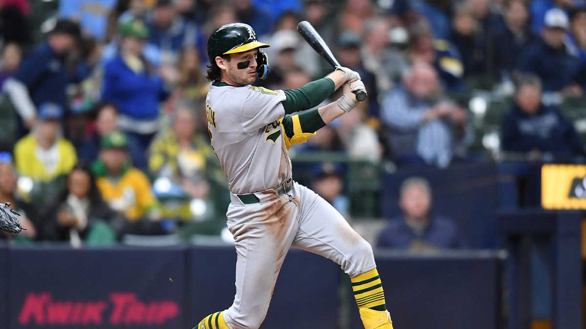 Athletics shortstop Jacob Wilson (5) hits a single during the seventh inning against the Milwaukee Brewers at American Family Field.