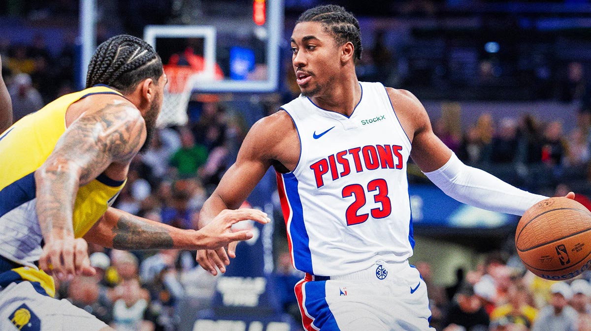 Detroit Pistons guard Jaden Ivey (23) dribbles the ball while Indiana Pacers forward Obi Toppin (1) defends in the second half at Gainbridge Fieldhouse.