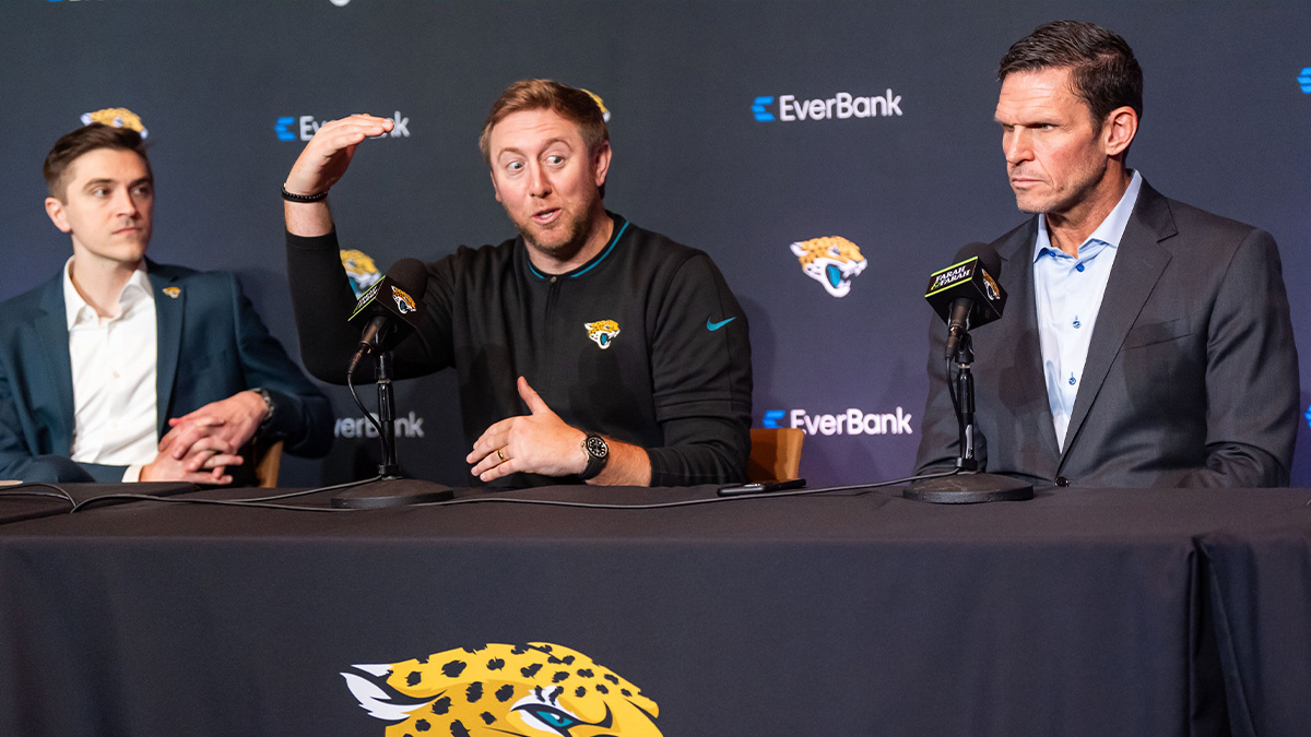 The Jacksonville Jaguars introduce General Manager James Gladstone, left, Monday morning February 24, 2025 at the Miller Electric Center in Jacksonville, Fla. as he listened to Head Coach Liam Coen, center, talk about how Gladstone was bringing a new level of skills to the organization during the press conference as Executive Vice President of Football Operations Tony Boselli, right, listened.