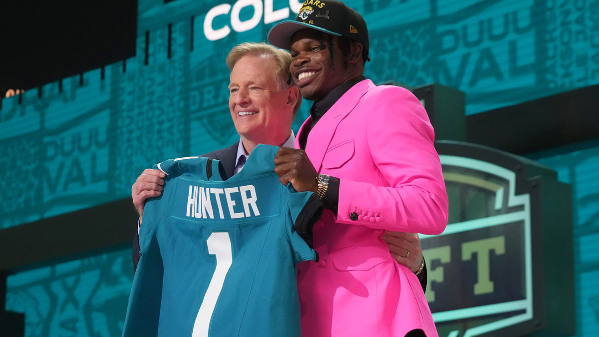 NFL commissioner Roger Goodell stands with Colorado Buffaloes wide receiver Travis Hunter after he is selected by the Jacksonville Jaguars as the number two pick in the first round of the 2025 NFL Draft at Lambeau Field.