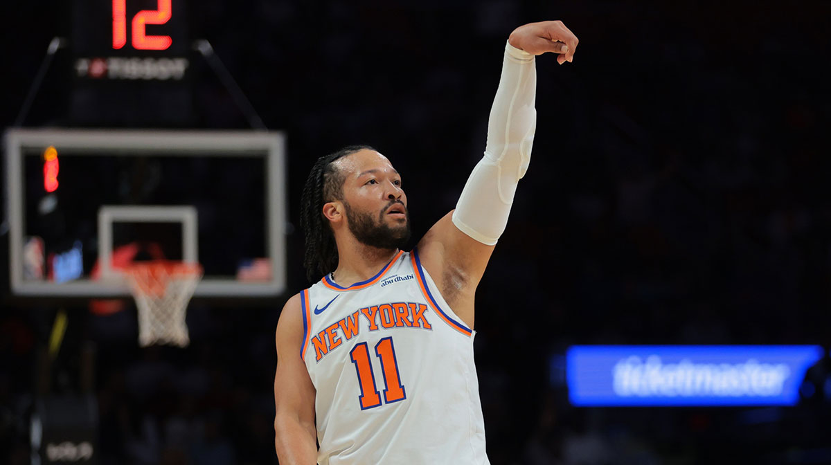 New York Knicks guard Jalen Brunson (11) watches his shot against the Miami Heat during the first quarter at Kaseya Center.