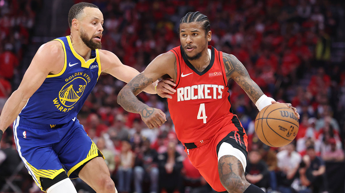 Houston Rockets guard Jalen Green (4) drives with the ball as Golden State Warriors guard Stephen Curry (30) defends during the third quarter at Toyota Center.