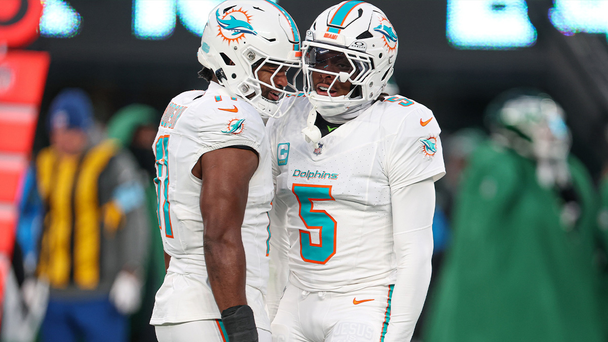 Miami Dolphins cornerback Jalen Ramsey (5) celebrates a defensive stop with linebacker Tyrel Dodson (11) during the first quarter against the New York Jets at MetLife Stadium.