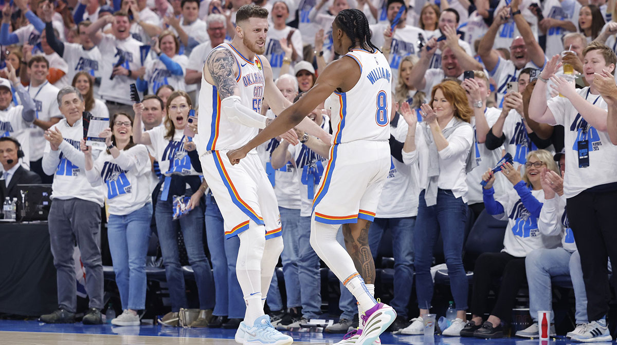 Oklahoma City Thunder center Isaiah Hartenstein (55) and forward Jalen Williams (8) celebrate against the Memphis Grizzlies during the second quarter at Paycom Center.