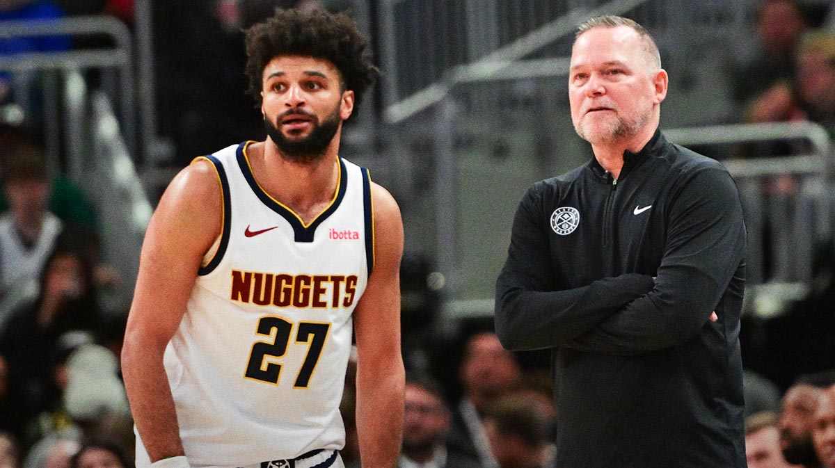 Denver Nuggets head coach Michael Malone and guard Jamal Murray (27) look on in the fourth quarter against the Milwaukee Bucks at Fiserv Forum.