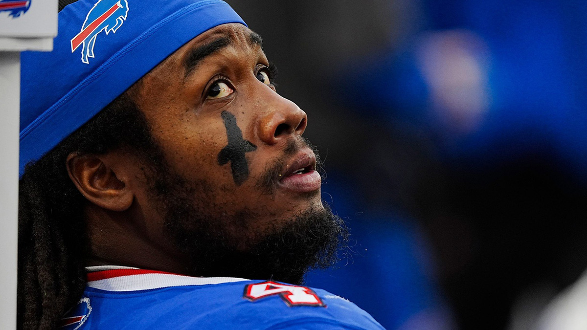 Buffalo Bills running back James Cook (4) takes a breather while the defensive line is on the field during second half of the Bills home game against the New York Jets at Highmark Stadium.