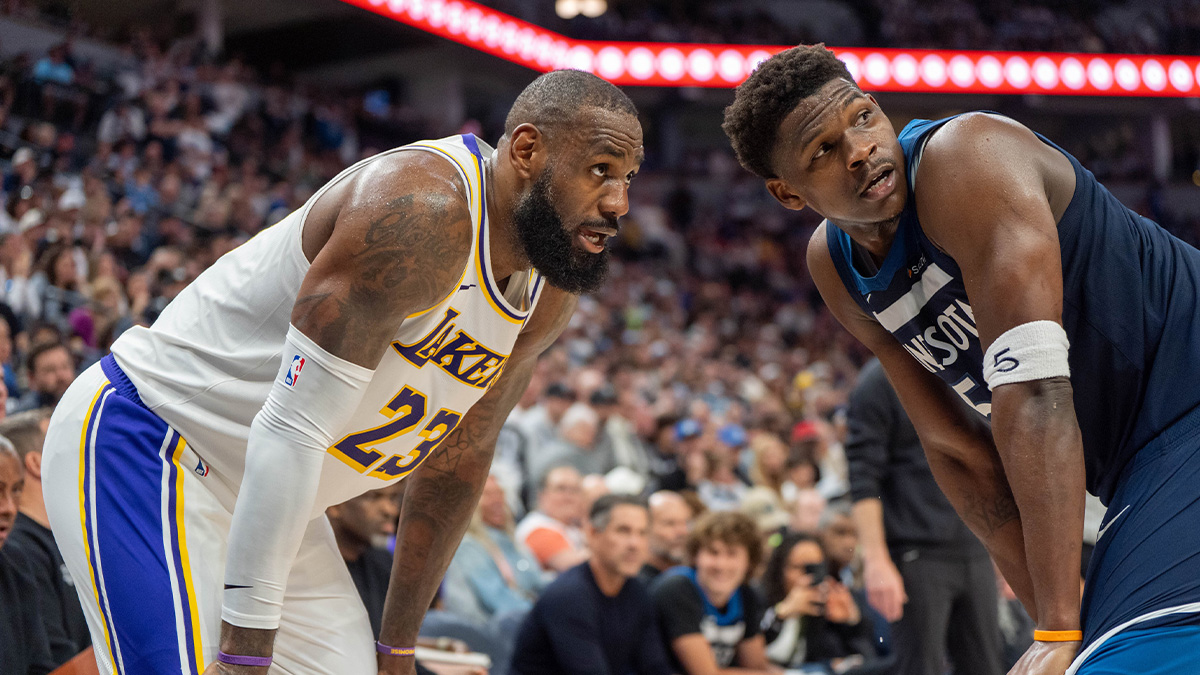 Minnesota Timberwolves guard Anthony Edwards (5) guards Los Angeles Lakers forward LeBron James (23) in the second quarter during game four of first round for the 2025 NBA Playoffs at Target Center.